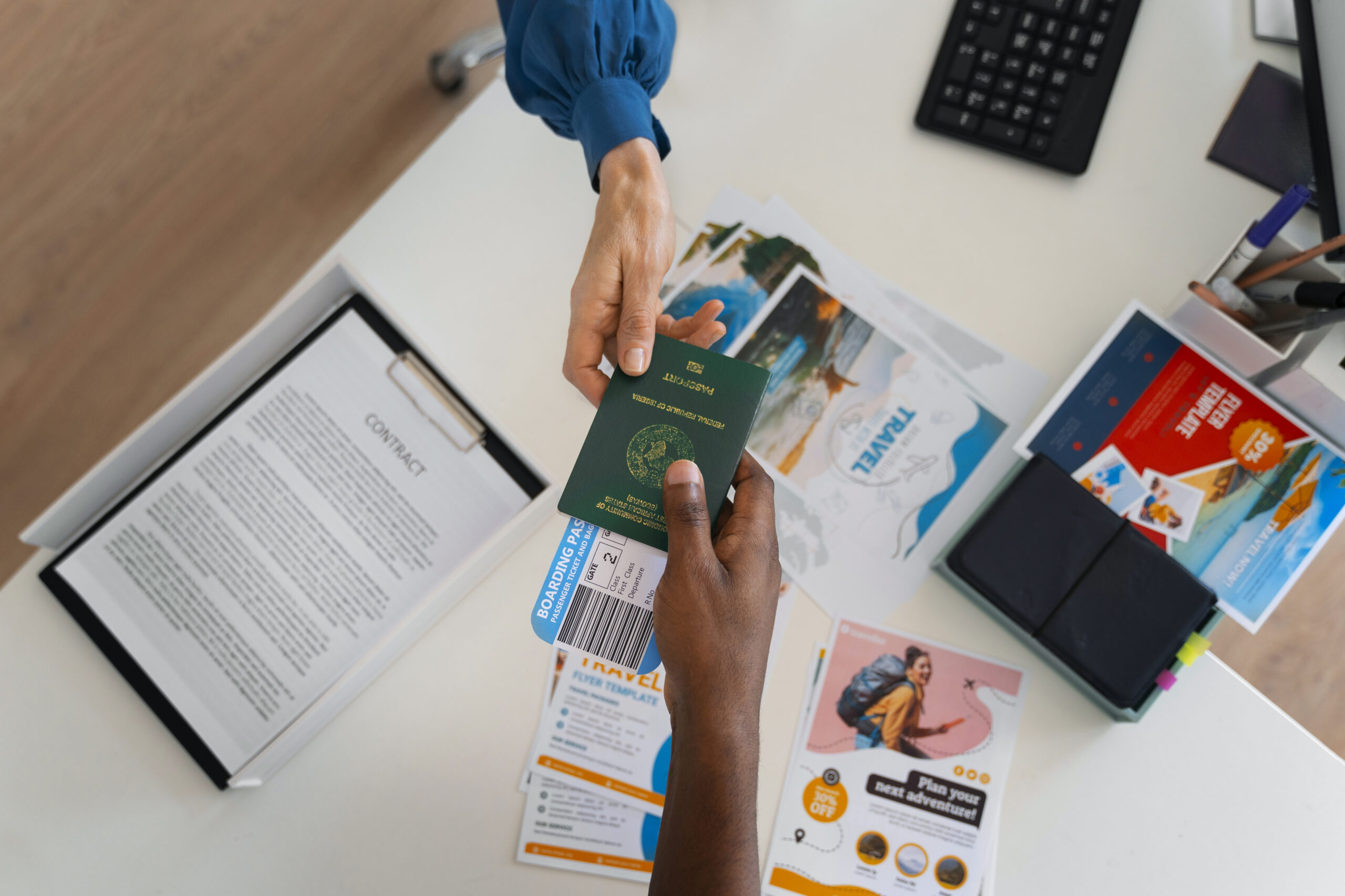 Top View Hands Holding Travel Documents Scaled